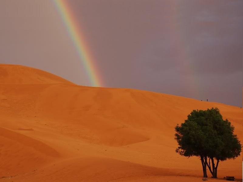 Rainbow over Desert Dunes