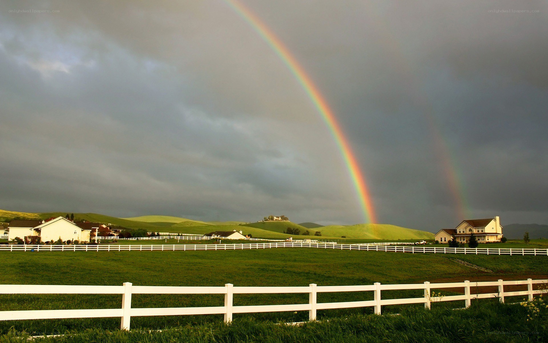 Rainbow over green hills