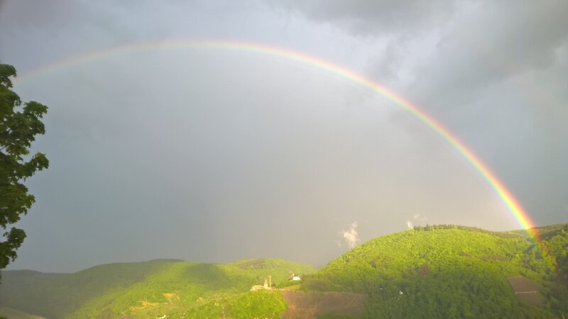 Rainbow over Green Hills — Dramatic, Afternoon, Photograph, Trees