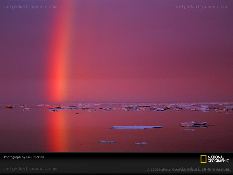 Rainbow over icy water