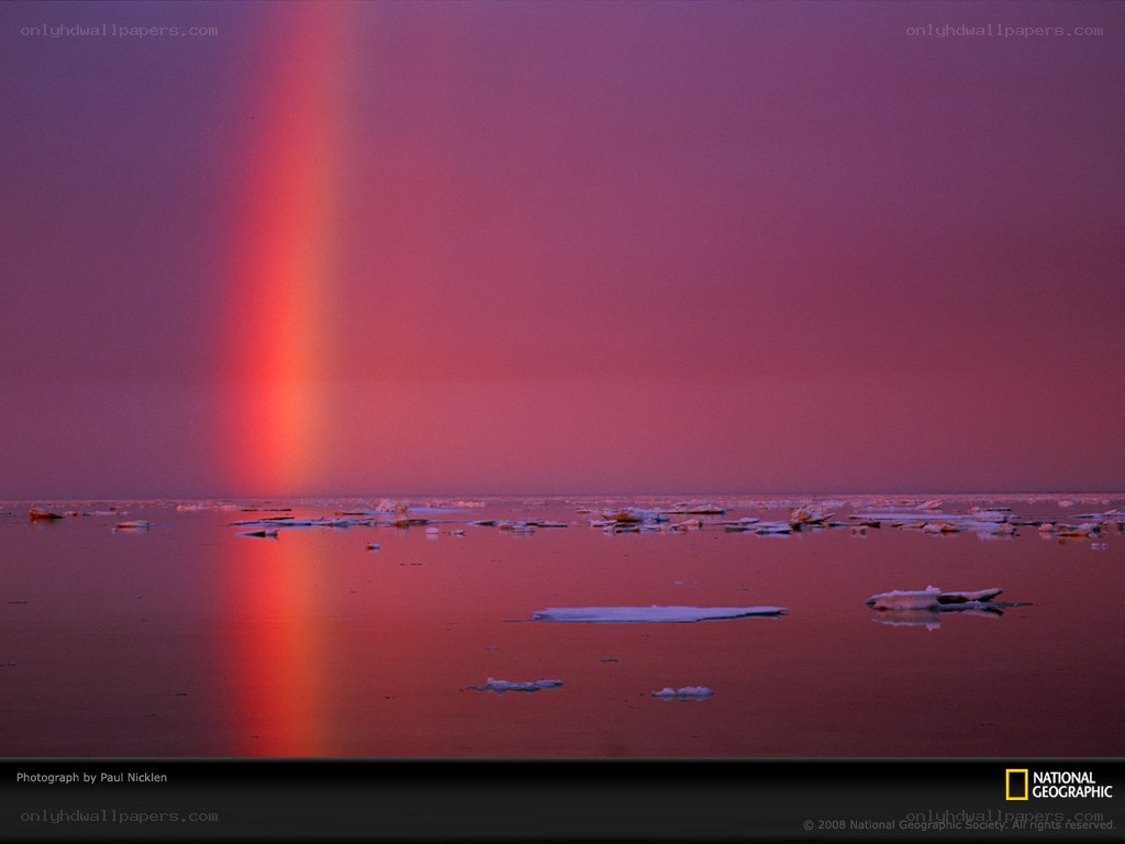 Rainbow over icy water