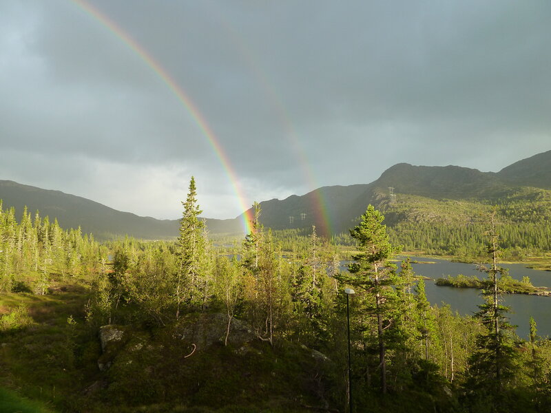 Rainbow over Lake and Mountains