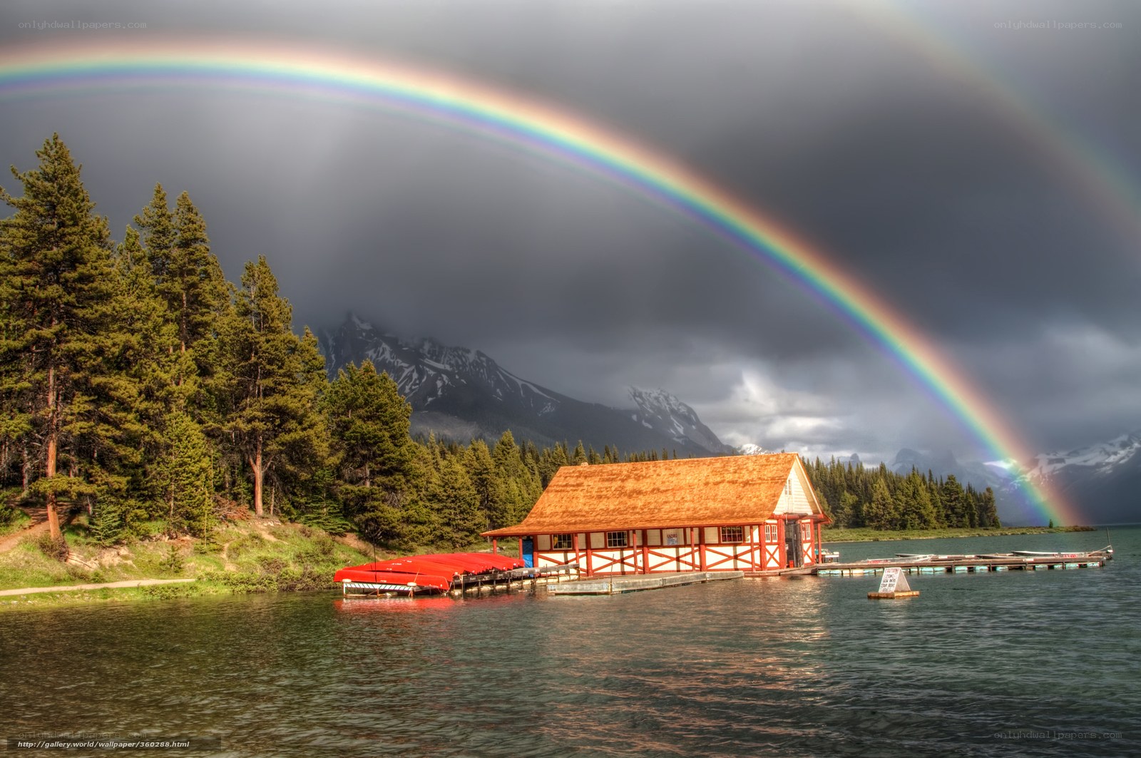 Rainbow over lake cabin