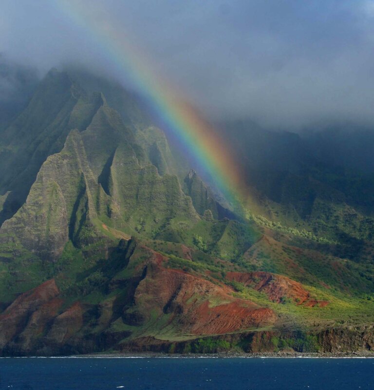 Rainbow over lush mountains
