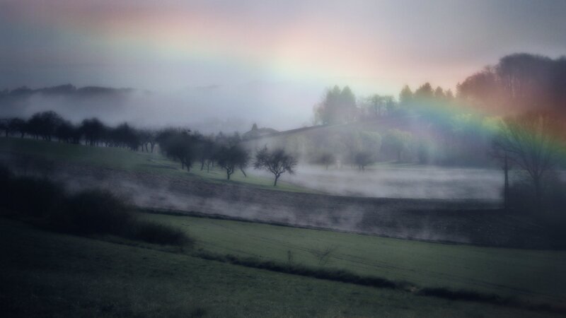 Rainbow over Misty Fields