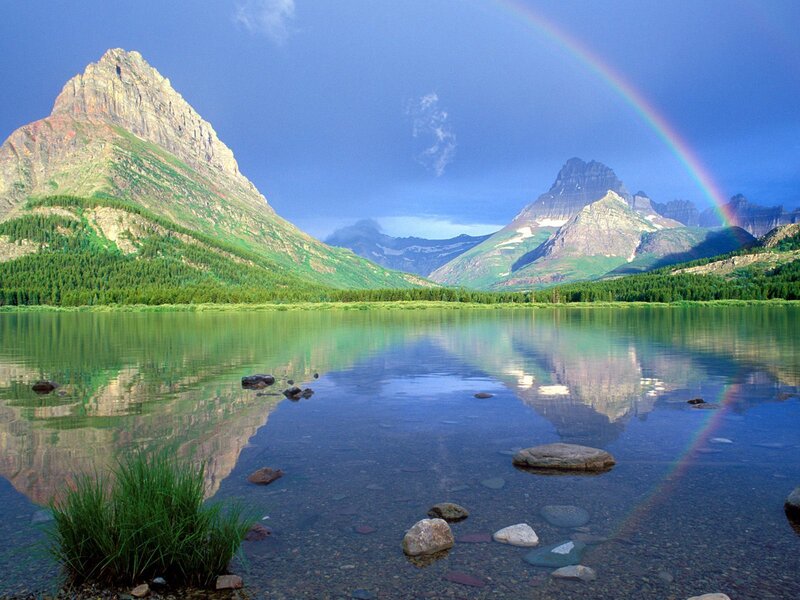 Rainbow over mountain lake