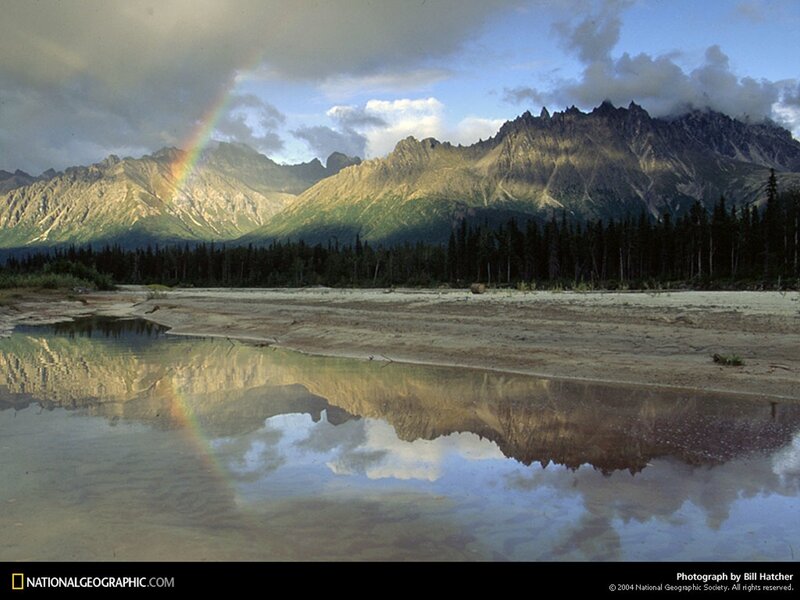 Rainbow over mountain lake