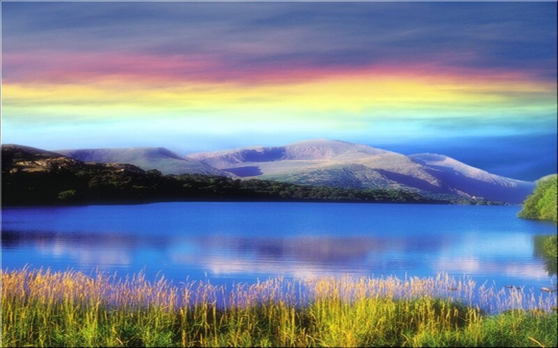 Rainbow over mountain lake