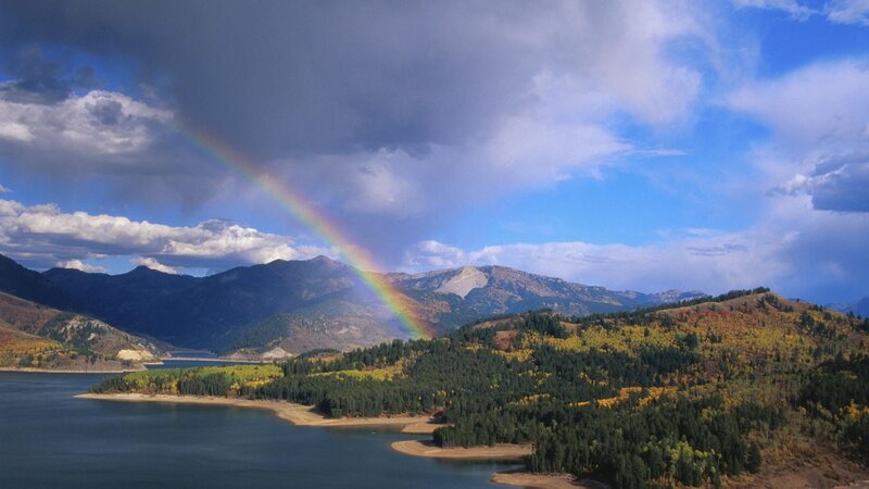 Rainbow over mountain lake