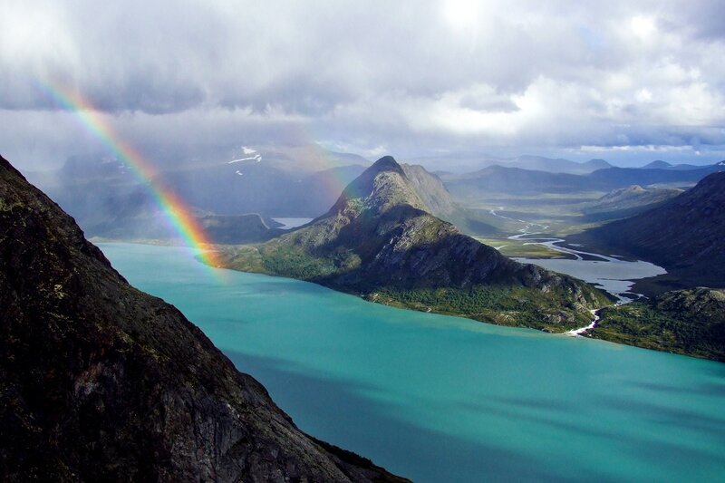 Rainbow over mountain lake