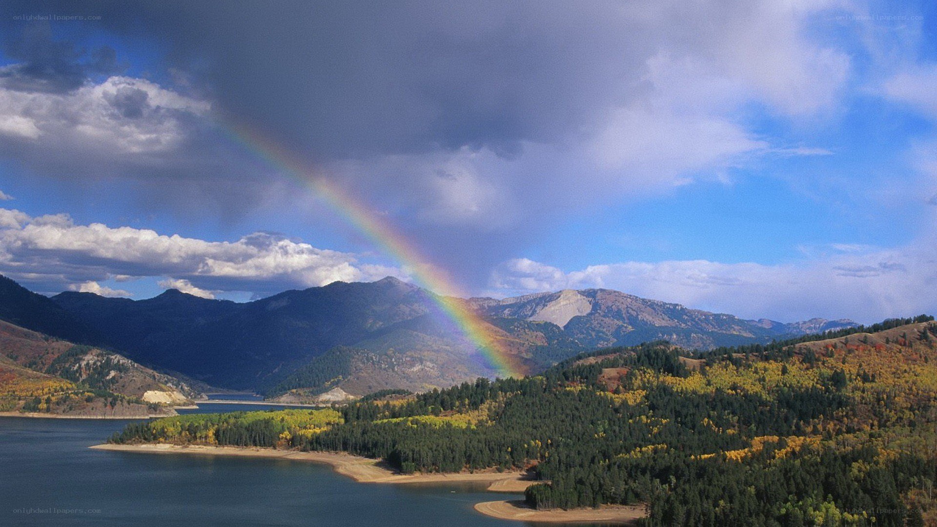 Rainbow over mountain lake