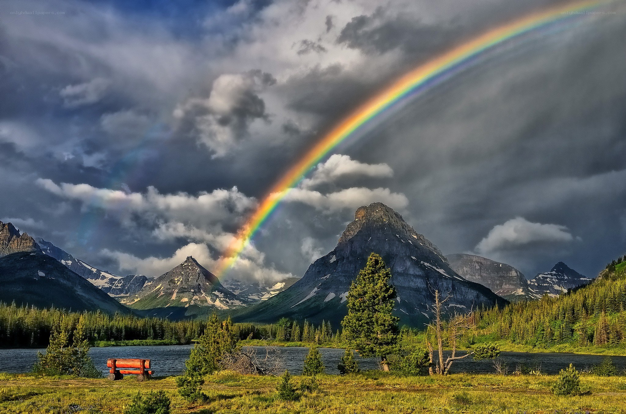 Rainbow over mountain lake
