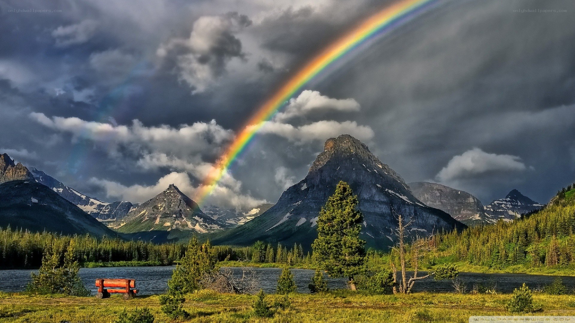 Rainbow over mountain lake