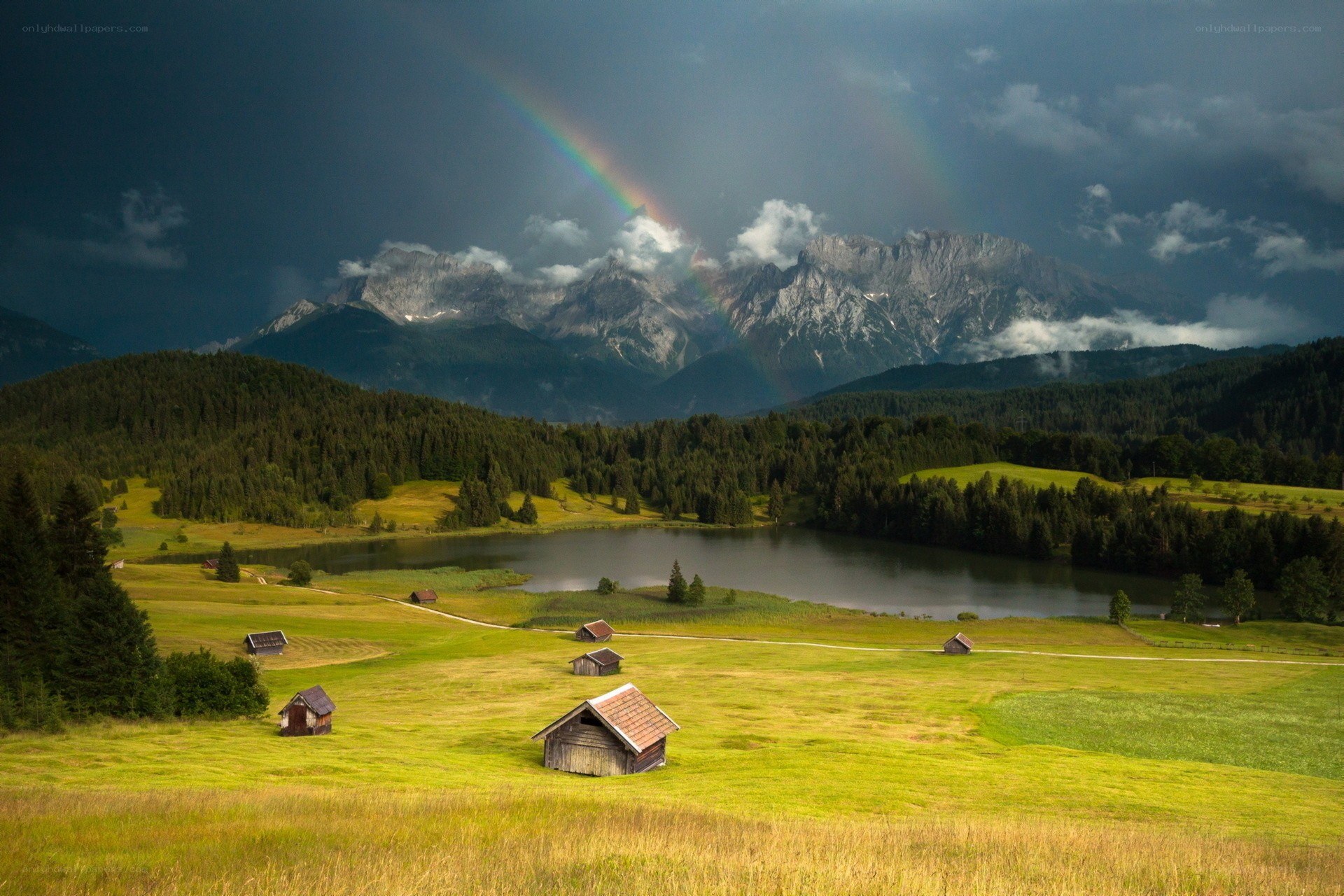 Rainbow over mountain lake