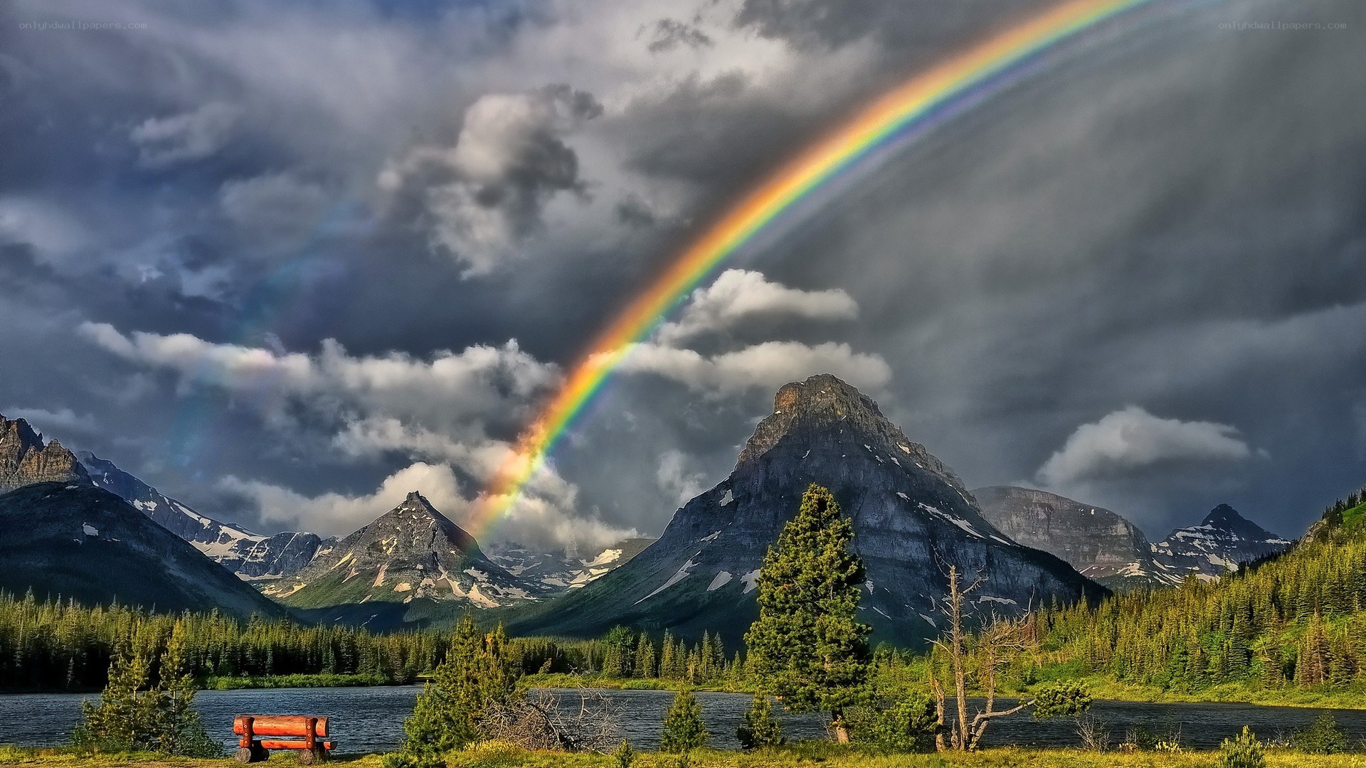 Rainbow over mountain lake