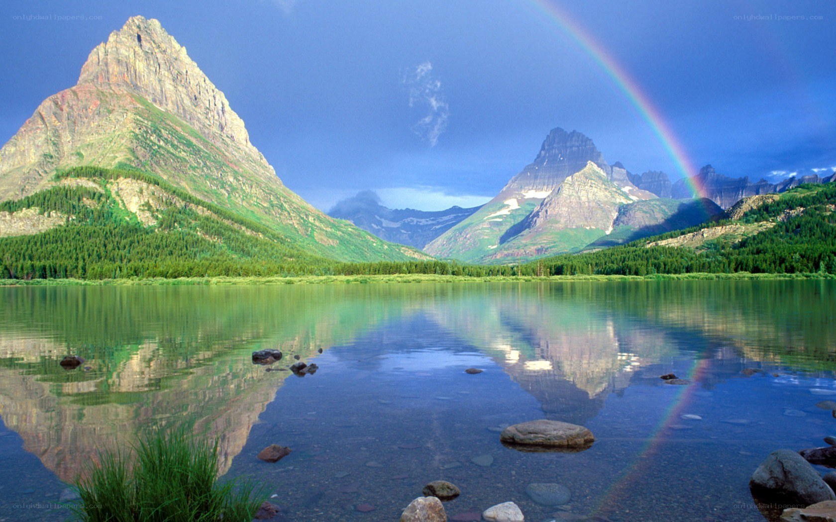 Rainbow over mountain lake