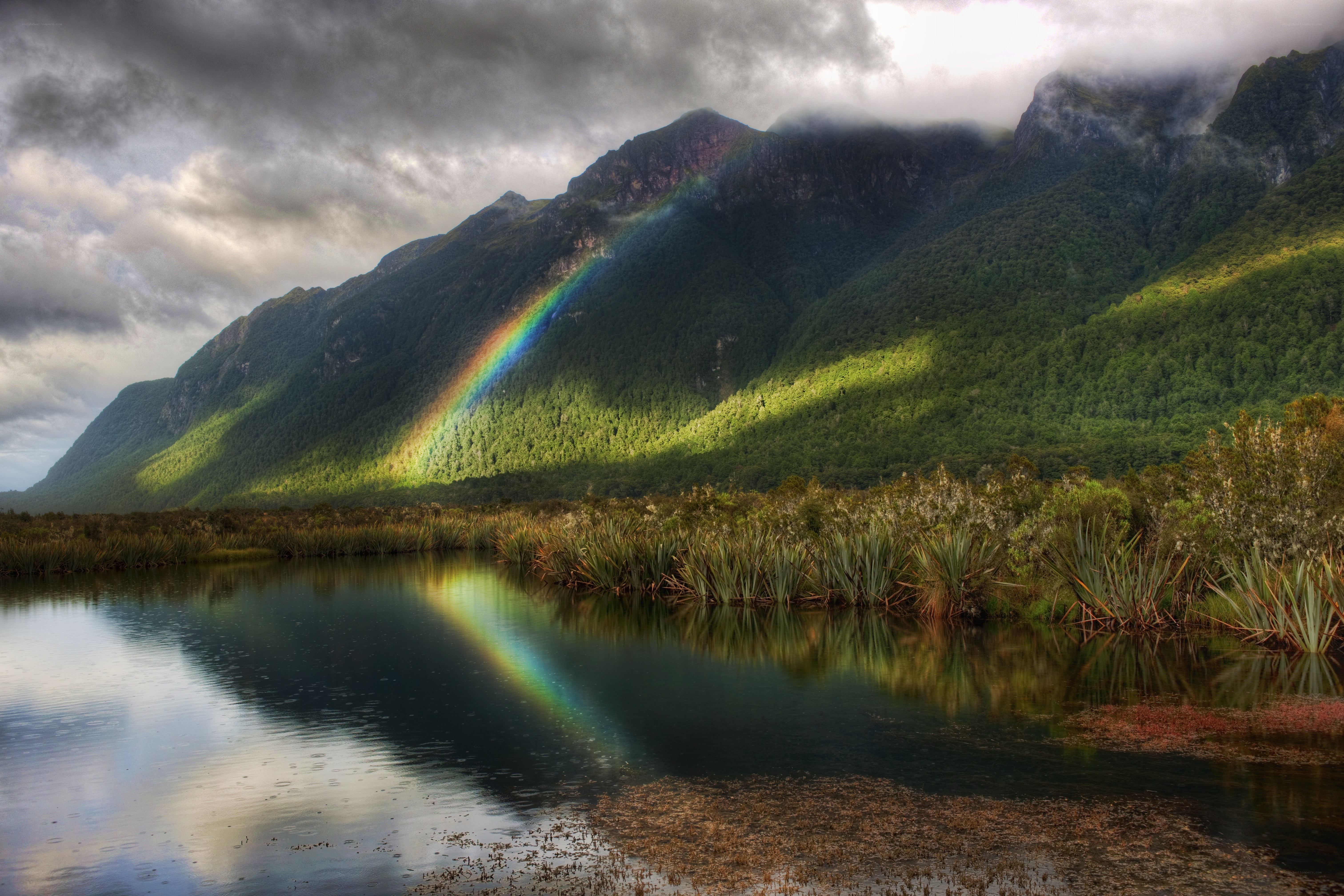 Rainbow over mountain lake