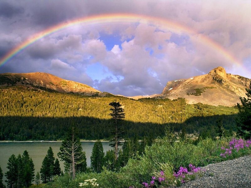 Rainbow over mountain lake