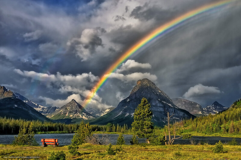 Rainbow over mountain lake
