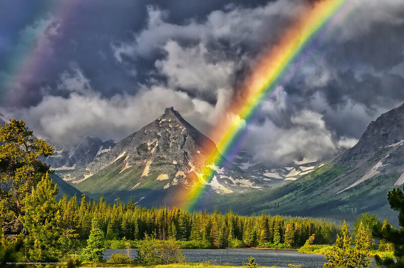 Rainbow over mountain lake