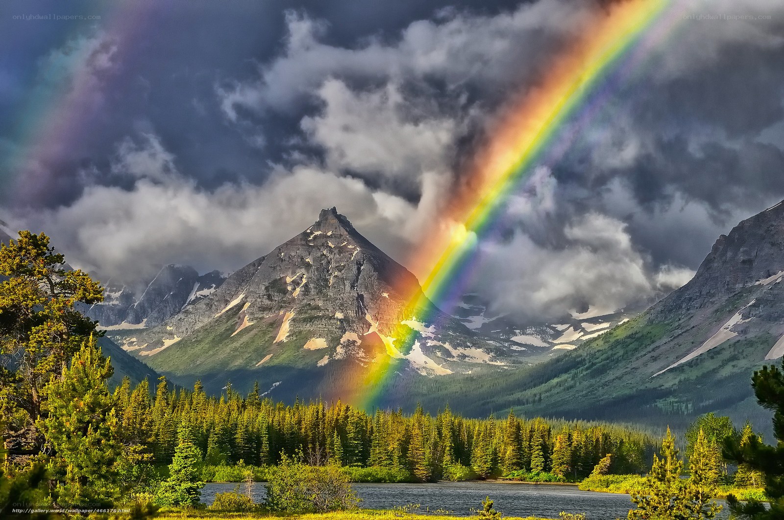 Rainbow over mountain lake