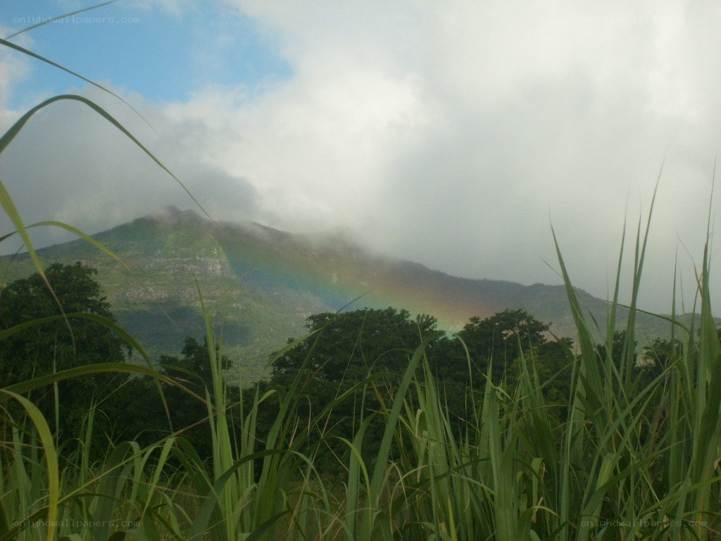 Rainbow over mountain landscape
