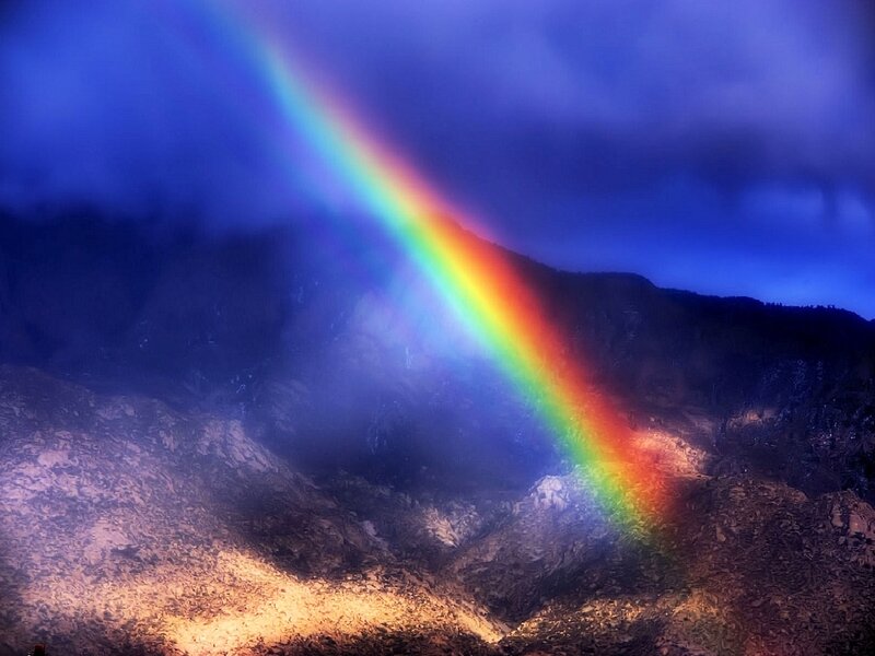 Rainbow over mountain landscape
