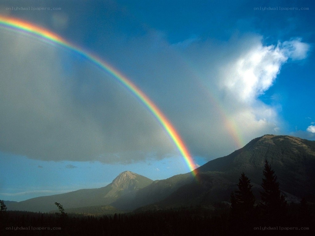 Rainbow over mountain landscape