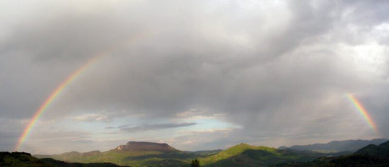 Rainbow over mountain landscape