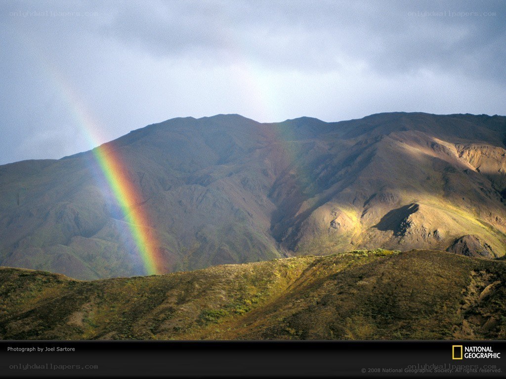 Rainbow over mountain landscape