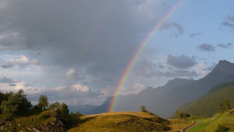 Rainbow over mountain landscape