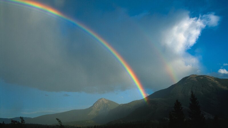 Rainbow over mountain landscape