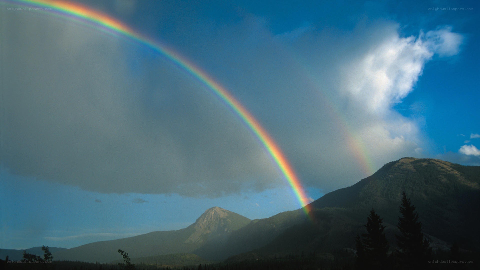 Rainbow over mountain landscape