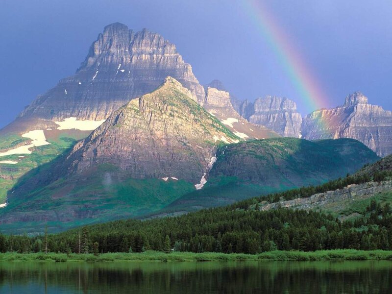 Rainbow over mountain peaks