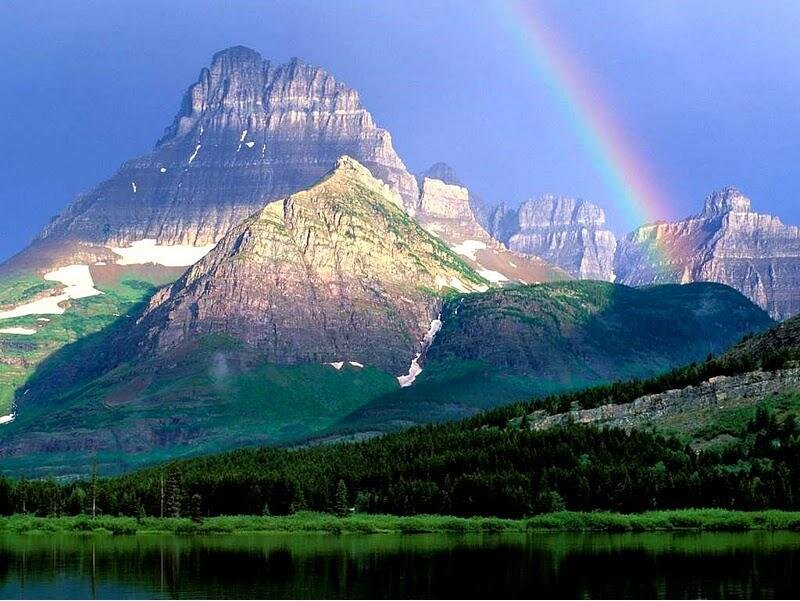 Rainbow over mountain peaks