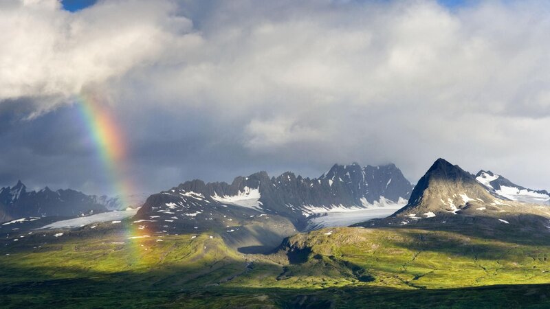 Rainbow over mountain range
