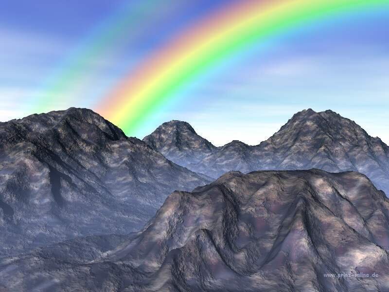 Rainbow over mountain range