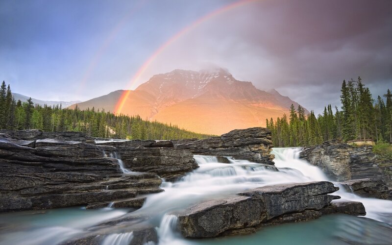 Rainbow over mountain river