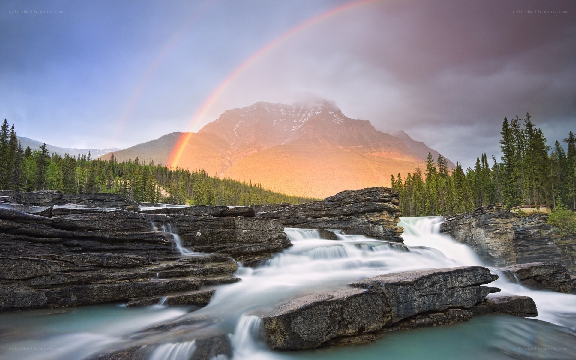 Rainbow over mountain river