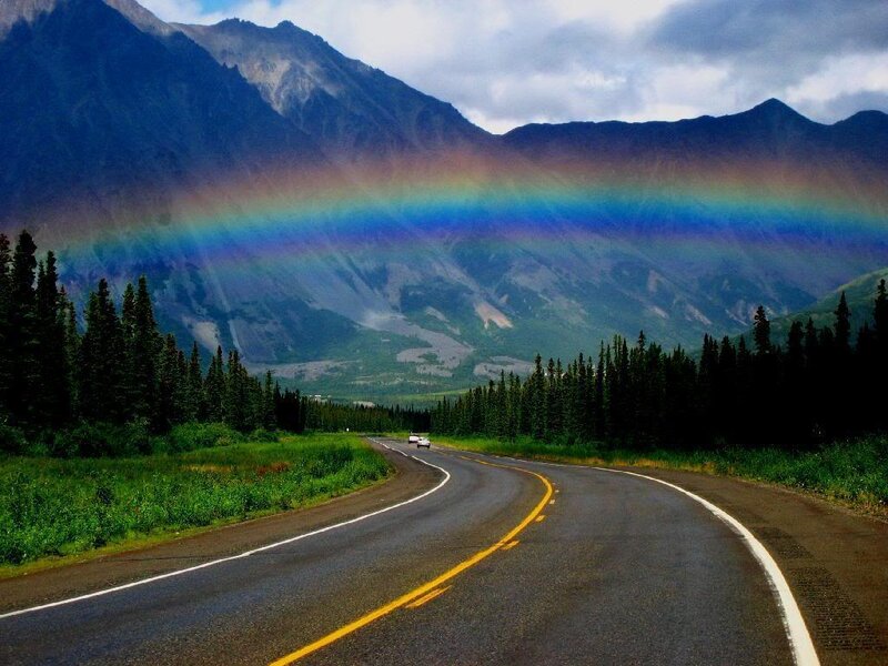 Rainbow over mountain road