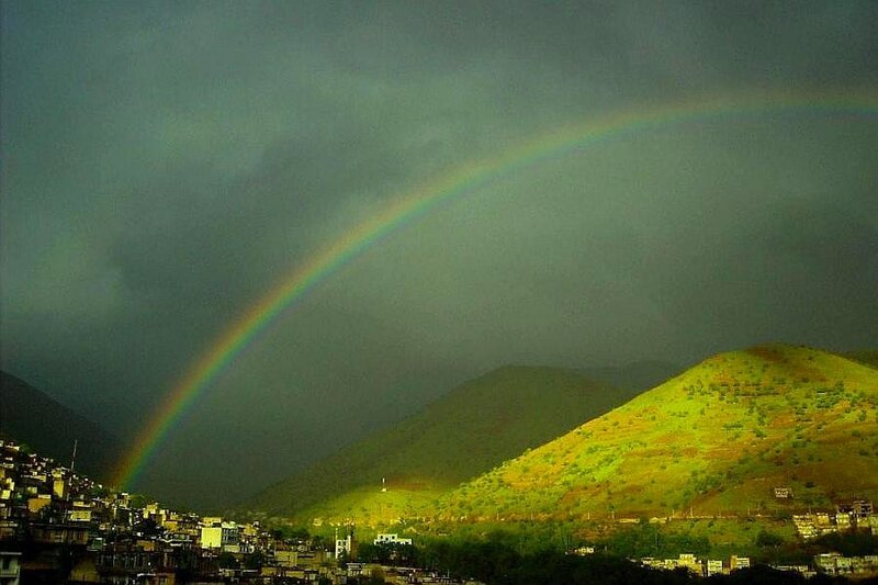 Rainbow over mountain town