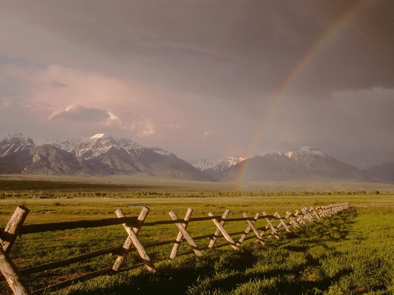 Rainbow over mountain valley