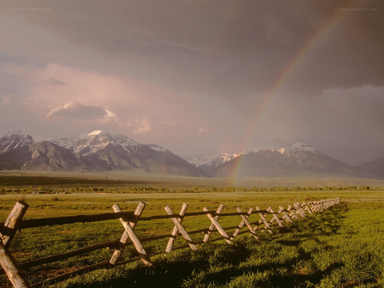Rainbow over mountain valley