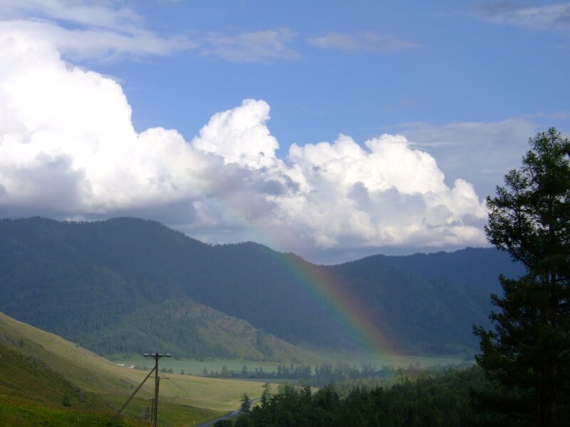 Rainbow over mountain valley