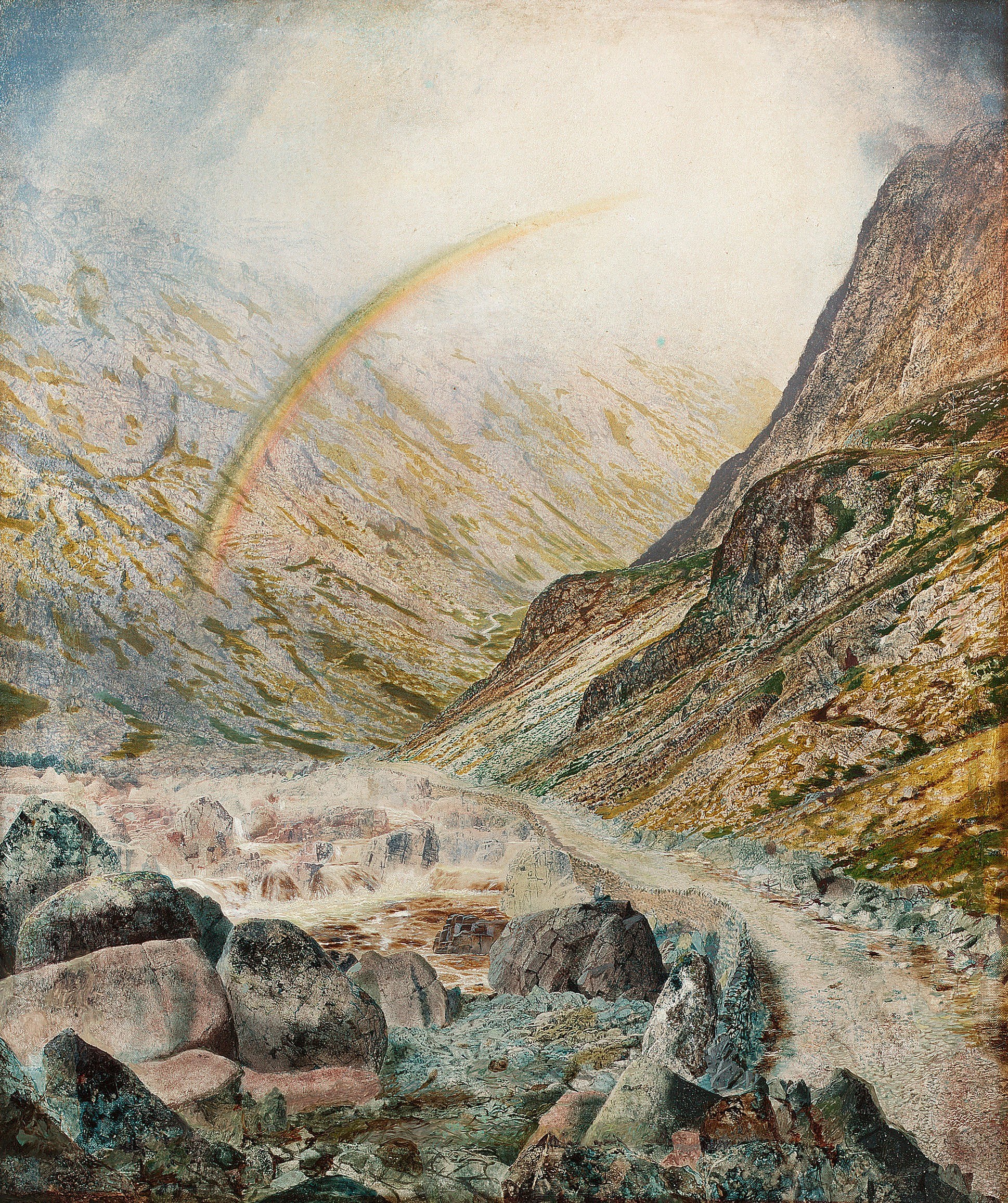 Rainbow over mountain valley