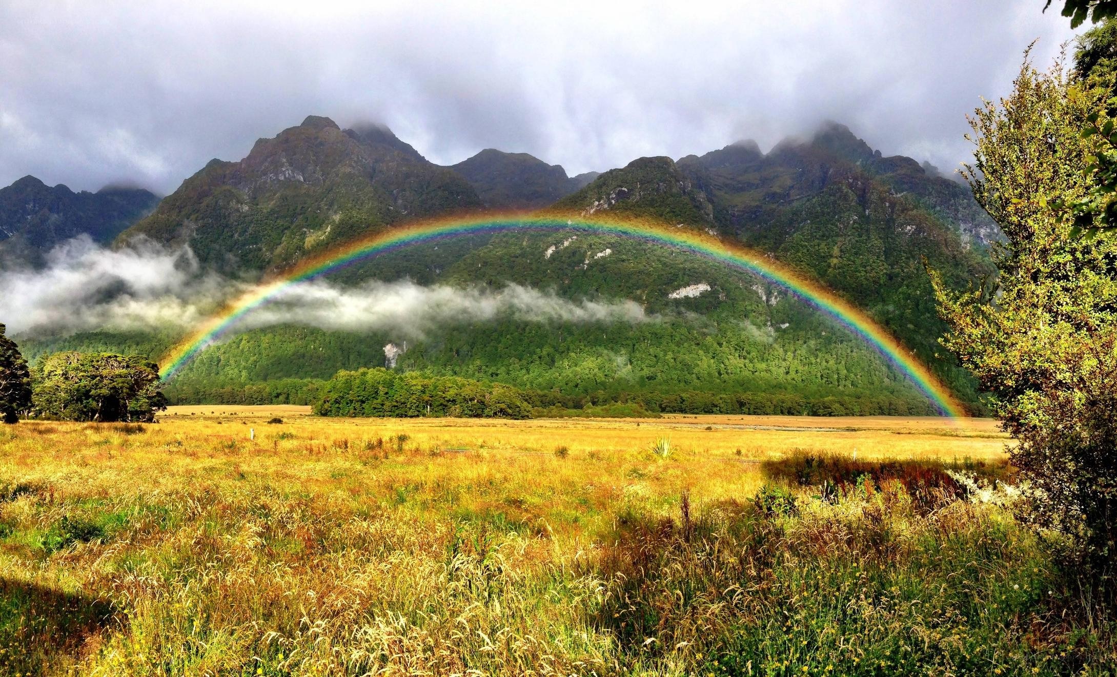Rainbow over mountain valley