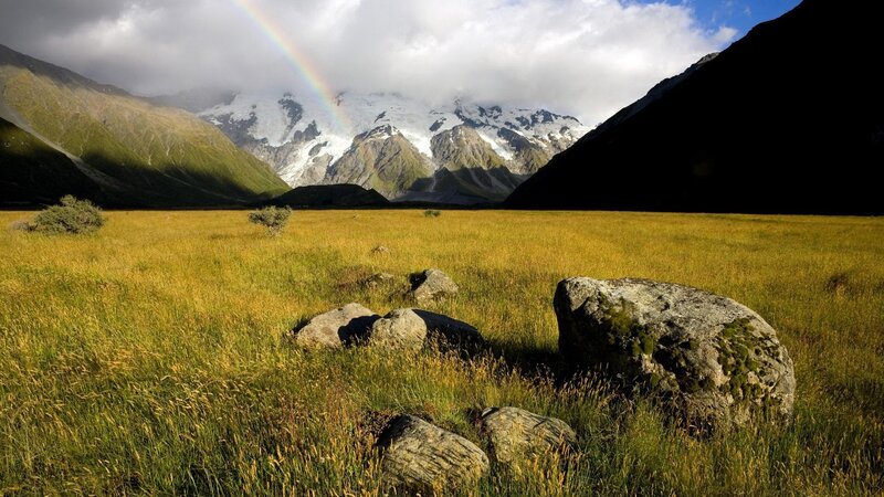 Rainbow over mountain valley
