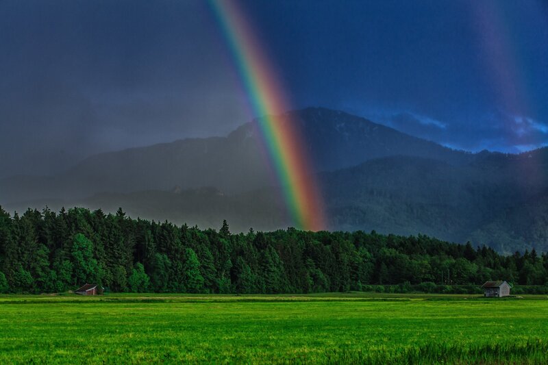 Rainbow over mountain valley