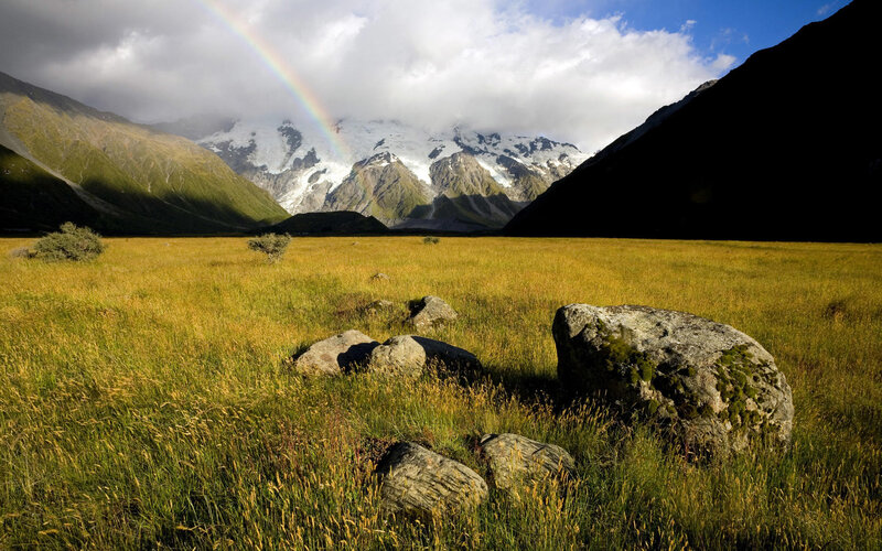 Rainbow over Mountain Valley — Green, Serene, Afternoon, Photograph, Grass Field, Rock