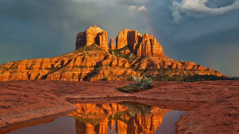 Rainbow over red rock formations